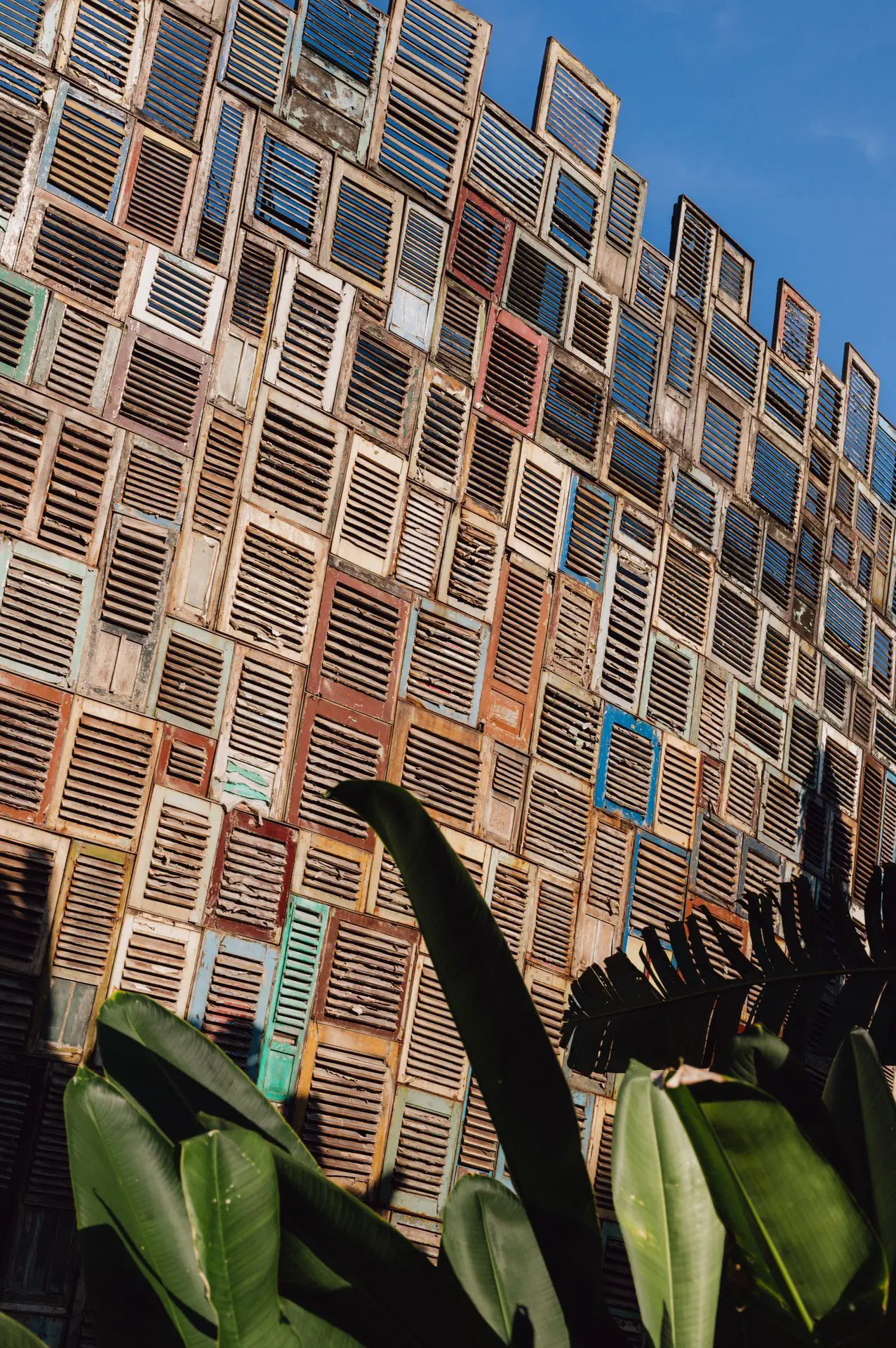 Facade made from reclaimed shutters at Potato Head Beach Club